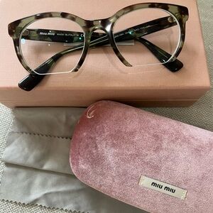 Green tortoise designer Miu Miu half lens prescription eyeglasses Made in Italy.